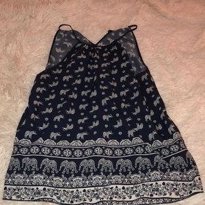 An detailed spaghetti strap shirt with elephants